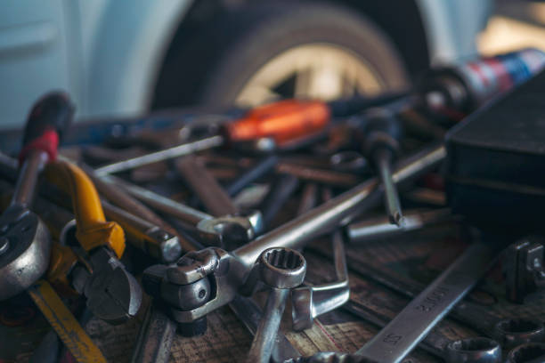 istock Mechanic tools engineering equipment car auto repair shop with copy space. Blurred background mechanical service. Heavy screw grungy rusted wrenches dirty screwdriver object. Industrial hardware set 2161082636