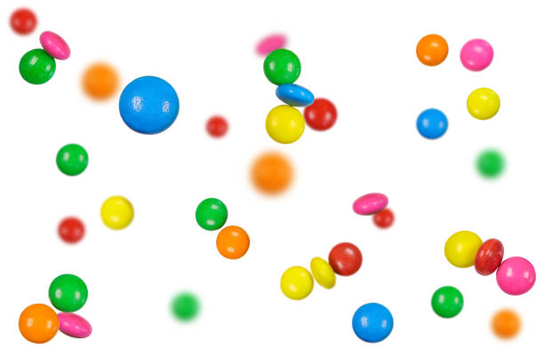 istock Colourful chocolate candies, multicolored glazed chocolate falling isolated on white background.Falling candied fruit,selective focus 2161084559