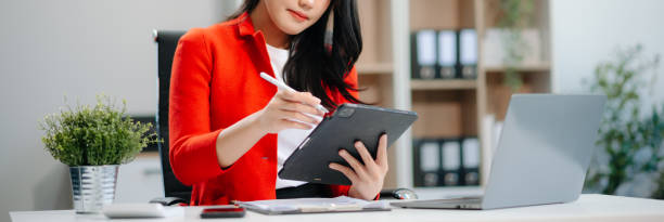 istock Businesswomen analyzing investment graph and discussing plan new start up project. 2161091730