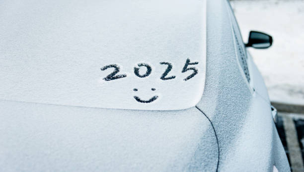 istock New year 2025 and smiling face written on car windshield 2161094878