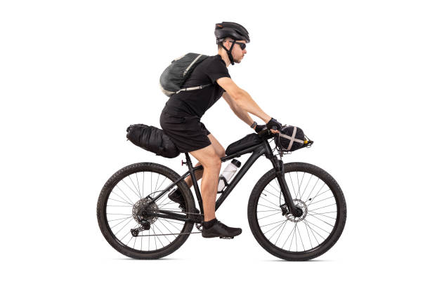 istock Cyclist on Touring Mountain Bike with Bags Isolated from Background 2161097607