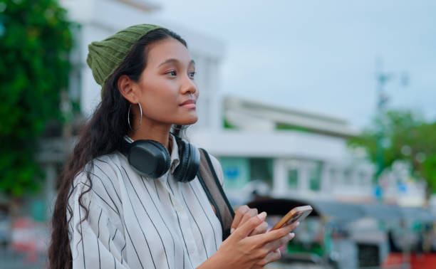 istock Asian woman using ai apps for call taxi 2161097846