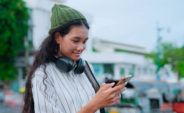 istock Asian woman using ai apps for call taxi 2161097848