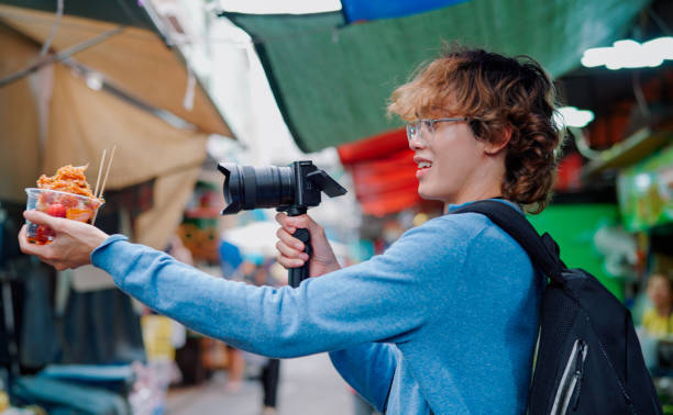 istock Asian man taking video at fruit salad shop 2161098354