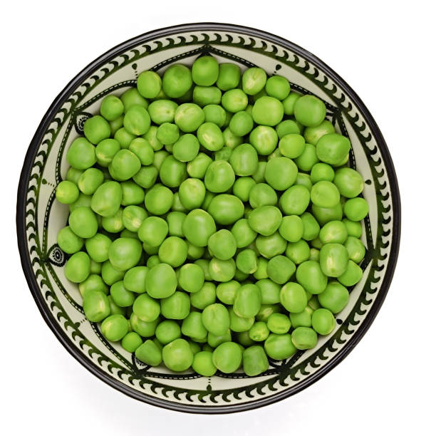 istock dish of raw peas, close-up. 2161100065