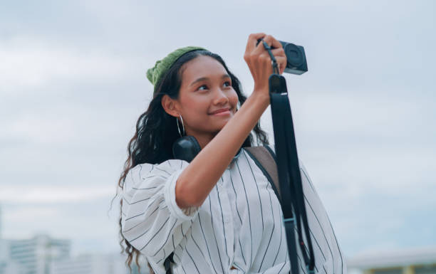 Young woman taking picture while travel