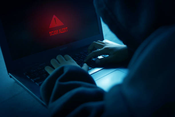 istock Scammer alerts and warning signs cyber ​​attack on online network 2161102478