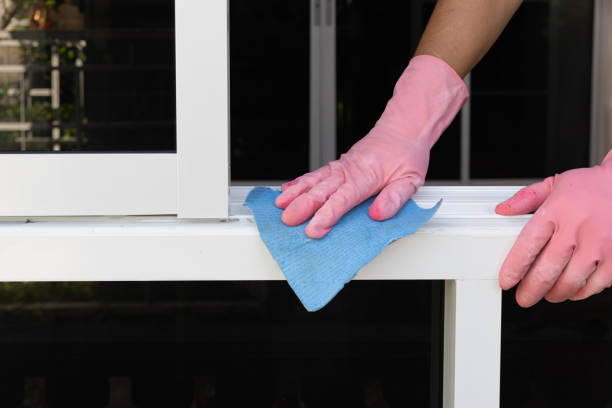 istock Worker use a soft cloth cleaning uPVC aluminum window frames remove a small dirty after install. 2161104163