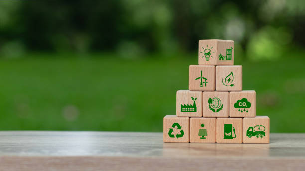 istock Green business and sustainable development. Save of earth, saving environment, net zero emissions. World earth day. wooden cubes with clean energy icon standing on eco friendly icon. ESG. Co2. 2161104298