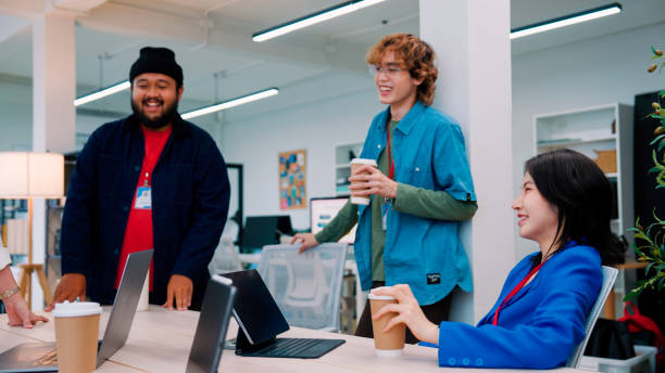 istock Group of young office workers looking at interesting things on laptop screen together. 2161106073