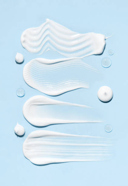 istock cosmetic smears cream texture on blue background 2161107285