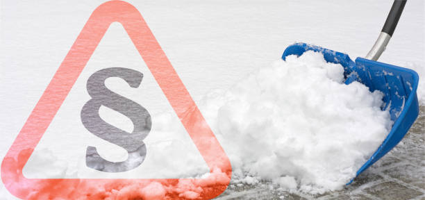 A snow shovel in action with paragraph symbol, panorama format