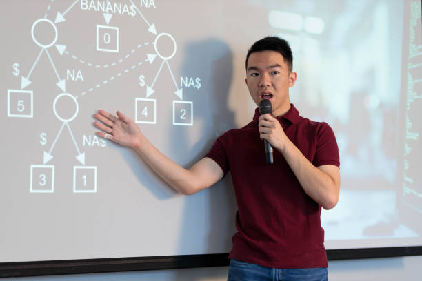 istock A student giving a presentation speech in a classroom and pointing 2161107645