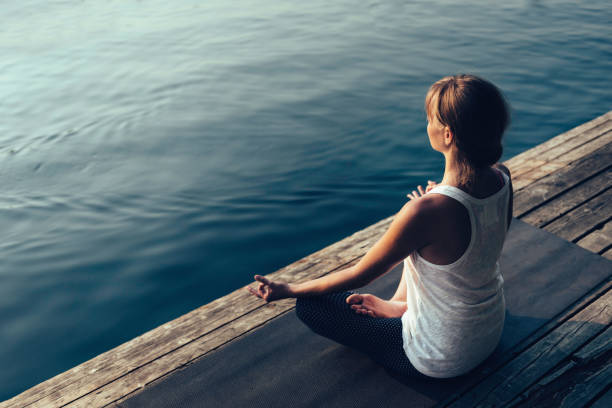 istock Woman in lotus position 2161108824