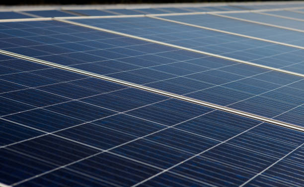 istock Solar panels power generation equipment, in the sun rays, solar panel with sunlight and sky background. concept clean energy power in nature 2161112441