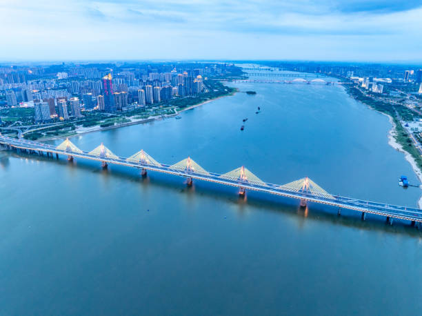 istock Night view of collapsed river bridge in modern city 2161113465