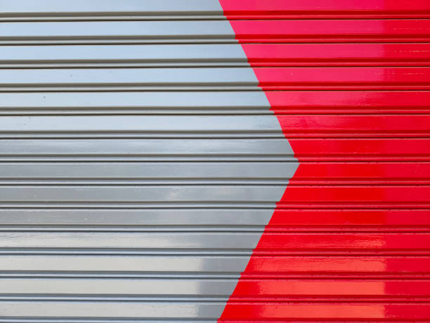 istock Red and grey color paint on rolling shutter door. 2161115318