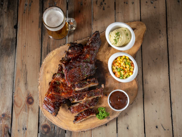 istock Baby back ribs on wooden board 2161115834