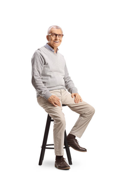 istock Cheerful elderly man sitting on a bar chair 2161120400