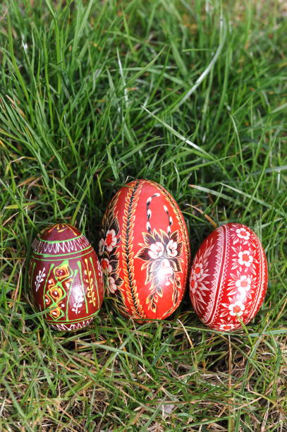 istock Traditional hand-dyed and hand-painted colourful Easter eggs in Poland called pisanka or kroszonka in green grass 2161123429