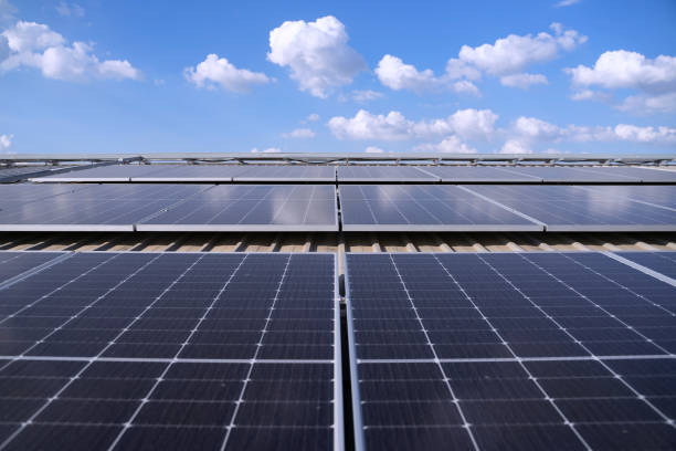 istock Blue collar workers are checking solar panel at roof top. 2161123799