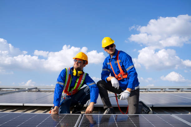 istock Blue collar workers are checking solar panel at roof top. 2161123872