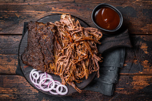 istock Traditional barbecue wagyu pulled beef on wooden board. Wooden background. Top view 2161126352