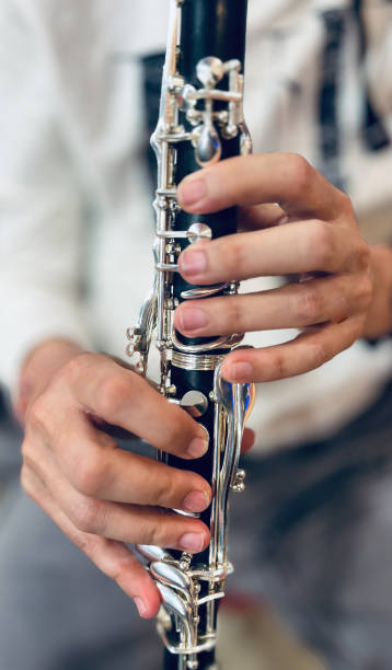 istock man playing clarinet only hands and clarinet 2161127735