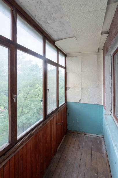 istock Balcony in bad condition. Old Soviet Russian Poor Interior. Shabby wooden floor. 2161133343