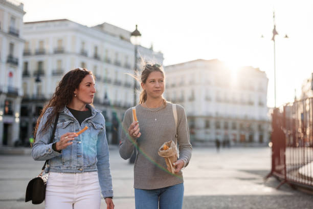 istock Two Women Exploring Madrid and Enjoying Churros 2161134681