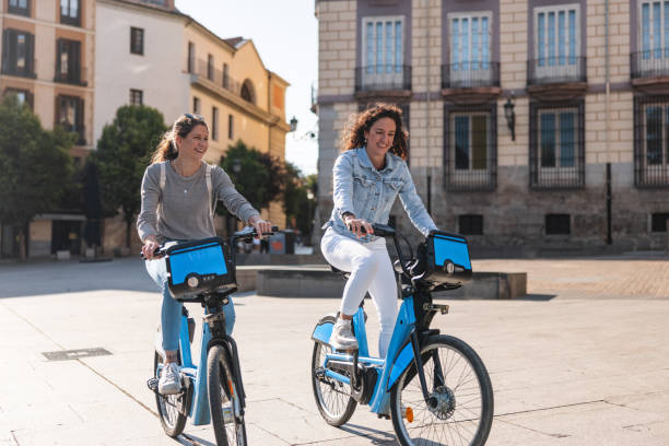 istock Two Friends on Bicycles Exploring Madrid Outdoors 2161134684
