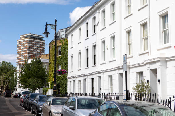 istock Old style houses contrasting with a modern tower block 2161139210