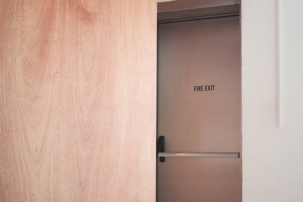 istock emergency fire exit metal door inside of a building 2161139811