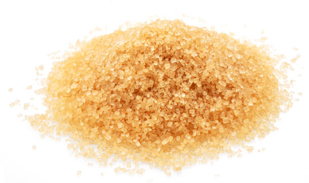 istock Pile of light brown sugar, isolated on white background. Top view. 2161140777