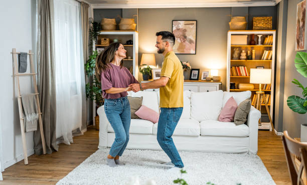 istock Happy couple dancing together at home 2161142255