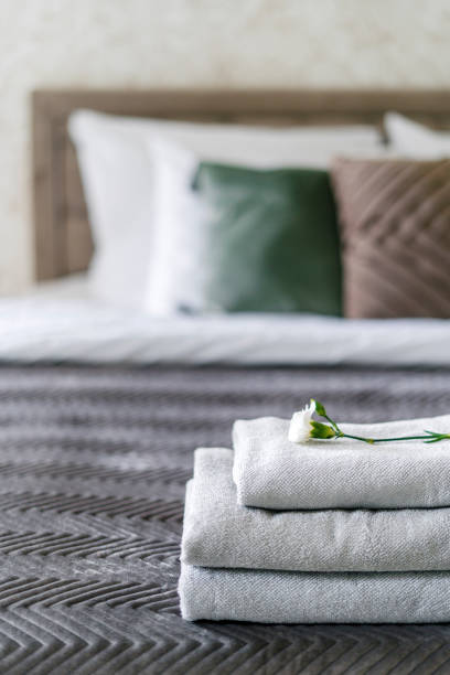 istock Selective focus at stack of clean and fresh towels with flower on top 2161143873