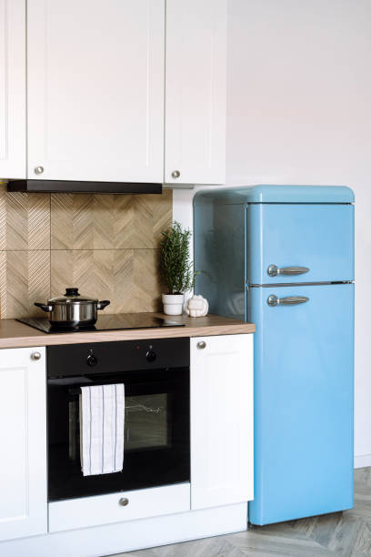 istock Induction hob, electric oven and refrigerator in retro style in modern kitchen 2161143875