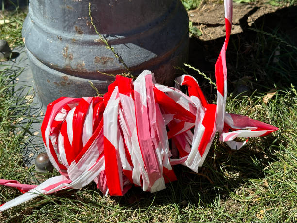 Red and white plastic tape on the ground