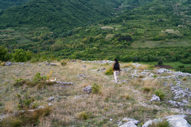istock Young woman exploring the mountain 2161146041