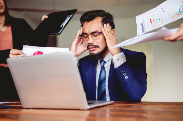 istock Fatigue from working a lot, problems with not being able to keep up with work Too much work gives you a headache. 2161148065