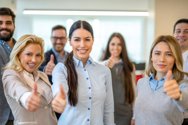 istock Business leaders group showing thumbs up and looking at camera. 2161148919
