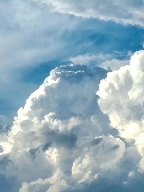 istock A cloud caravan. Puffy and broght clouds in the sky. 2161152570