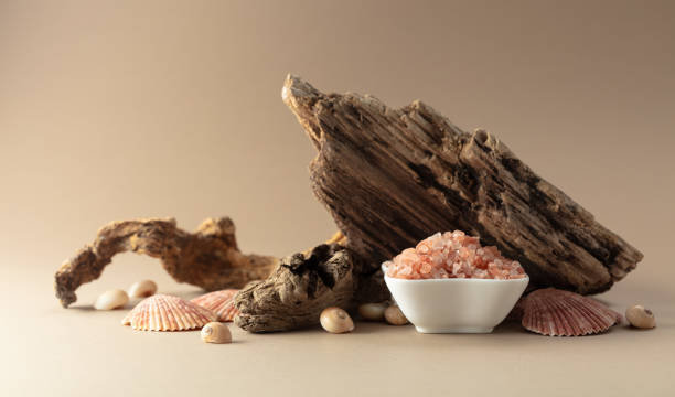 istock Pink himalayan salt with snags and seashells on a beige background. 2161154515