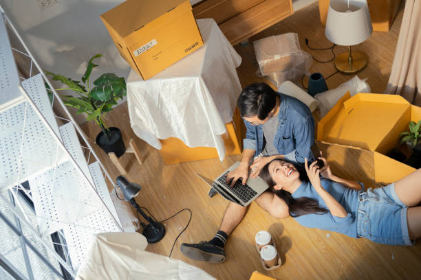 istock happiness asian lover couple lying on your lap postive conversation taking a break between home relocation home moving in to new house happiness casual house renovation, asian couple lying on floor 2161157117