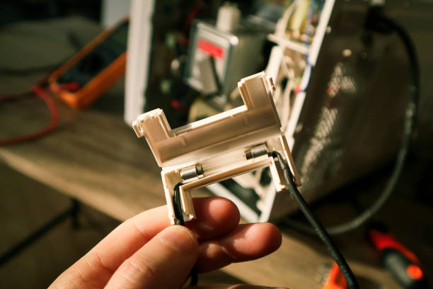 istock Microwave oven repair. Blown high voltage fuse. 2161158020