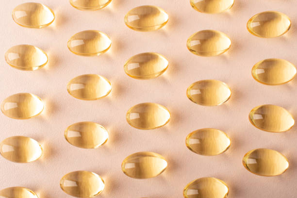istock Pattern omega 3 close up. Background fish oil. Vitamins soft capsules. Cod liver oil. Concept of healthcare, supplements, vitamin D, treatment. Copy space, top view, banner. High quality photo 2161158526