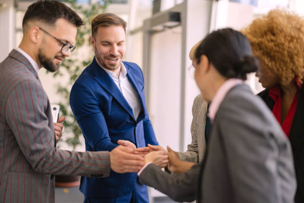 istock Business professionals shaking hands in modern office 2161159371