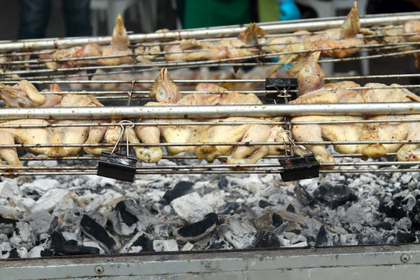 Grilled chicken on the flaming grill