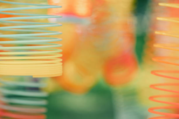 Lots of bright colorful spirals. Abstract blurred background with selective focus on waves. High quality photo