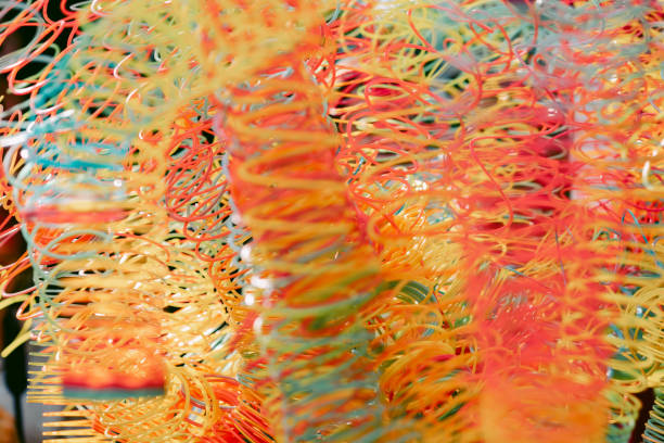 Lots of bright colorful spirals. Abstract blurred background with selective focus on waves. High quality photo